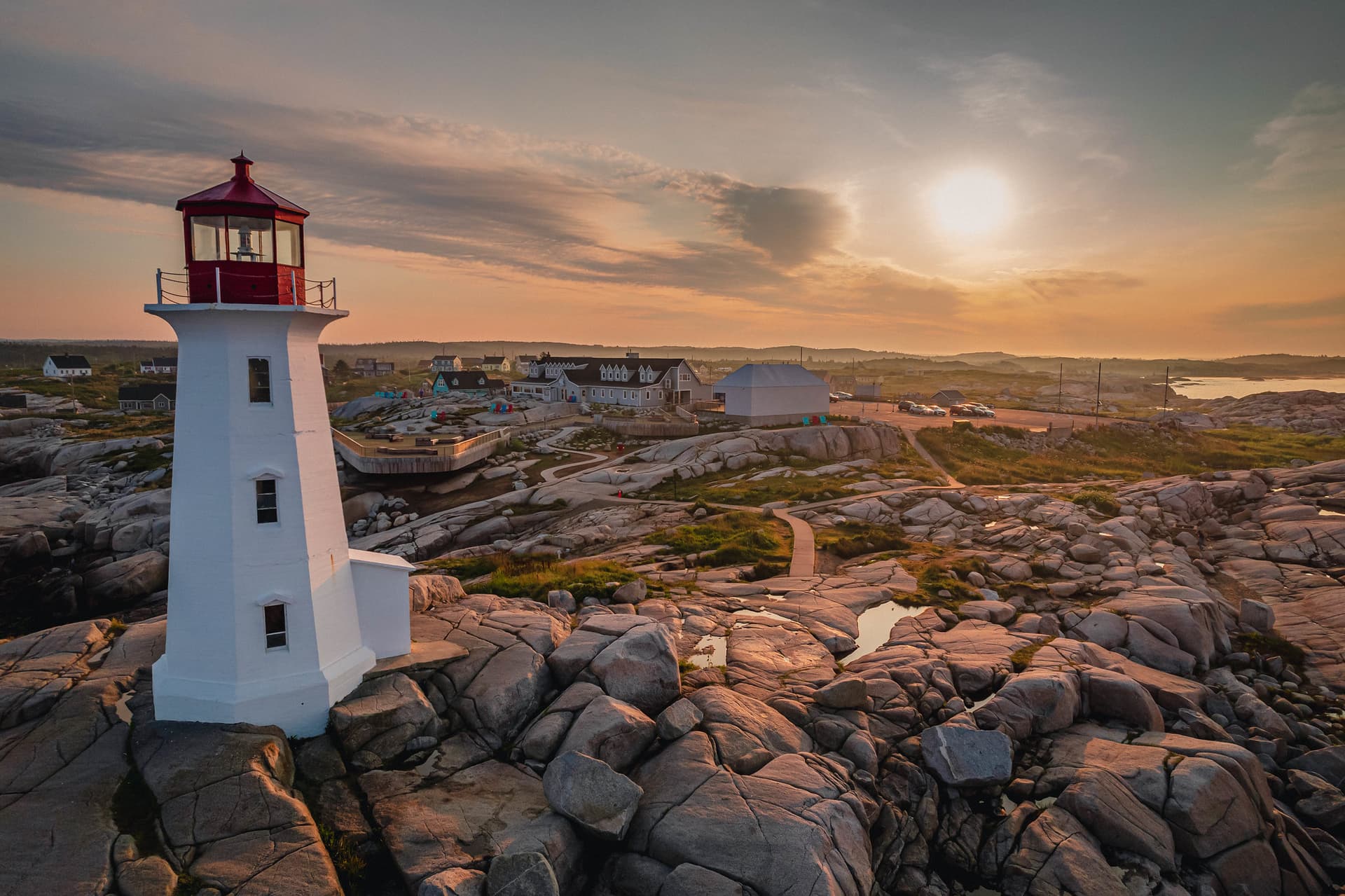 A coastal lighthouse photographed at blue hour